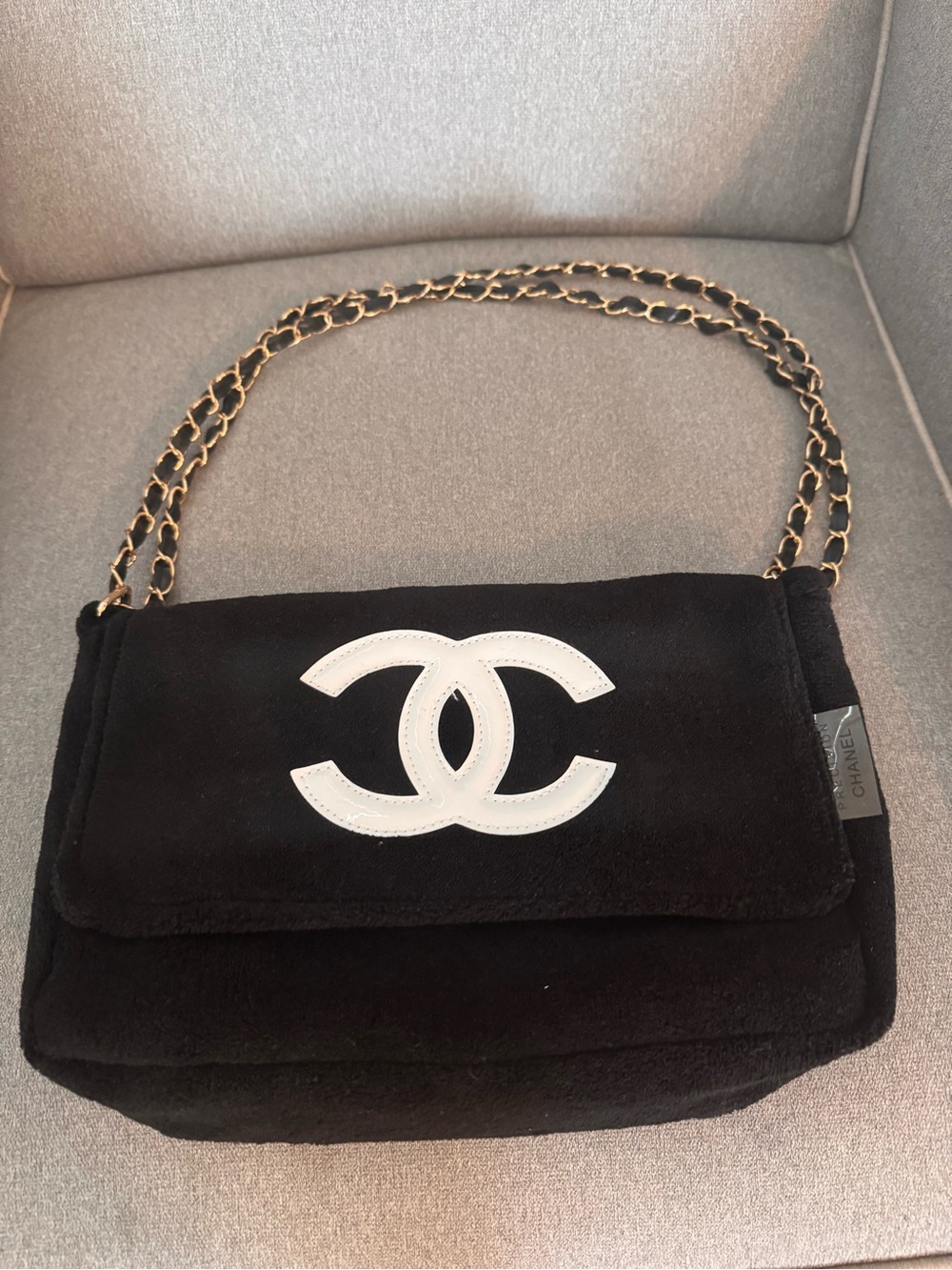 CHANEL Black Suede Shoulder Bag with White CC Emblem